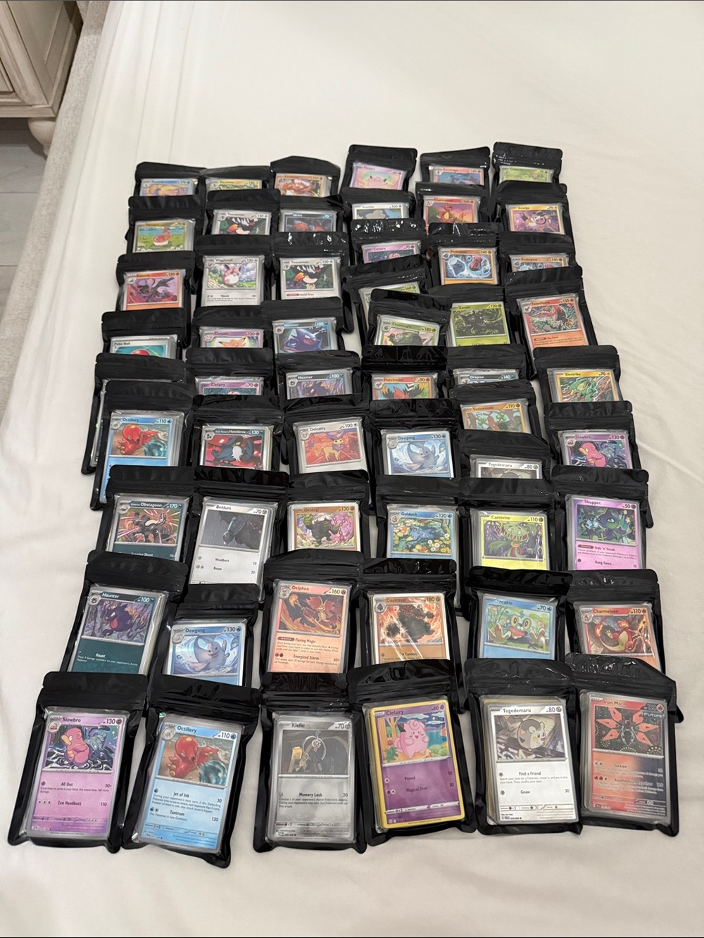 Pokemon Trading Cards Lot with Black Sleeves - Multicolor
